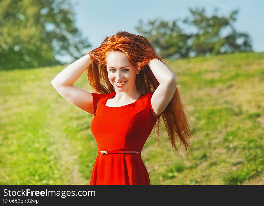 Redhead young woman outdoor in summer. Redhead young woman outdoor in summer