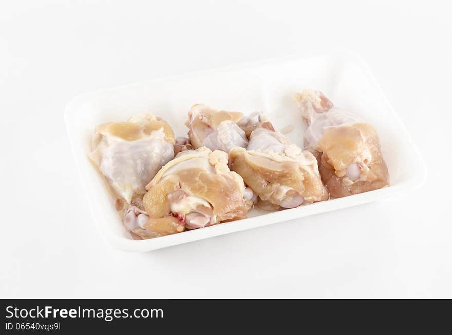 Food fresh chicken in foam isolated on white background. Food fresh chicken in foam isolated on white background