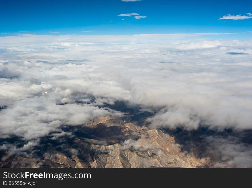 Himalaya mountains under clouds. India