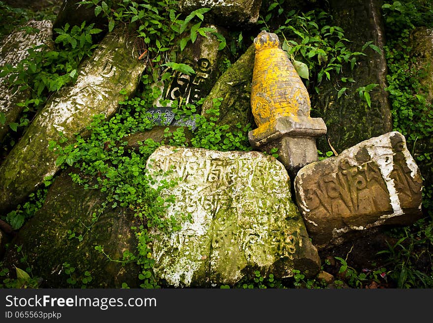 Ancient Buddhist prayer stones with written mantra. Ancient Buddhist prayer stones with written mantra