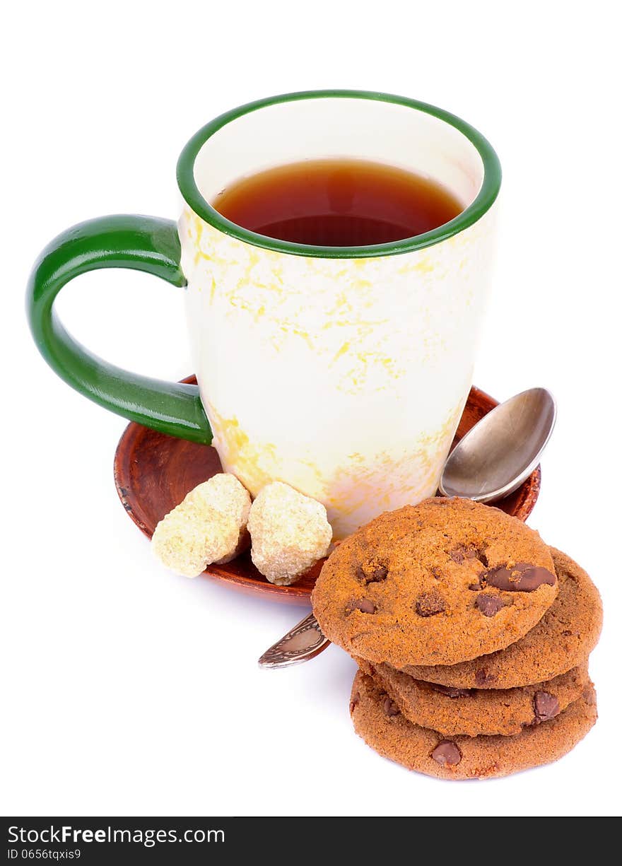 Cup of Tea with Sugar Cubes, Tea Spoon and Chocolate Chip Cookies isolated on white background. Cup of Tea with Sugar Cubes, Tea Spoon and Chocolate Chip Cookies isolated on white background