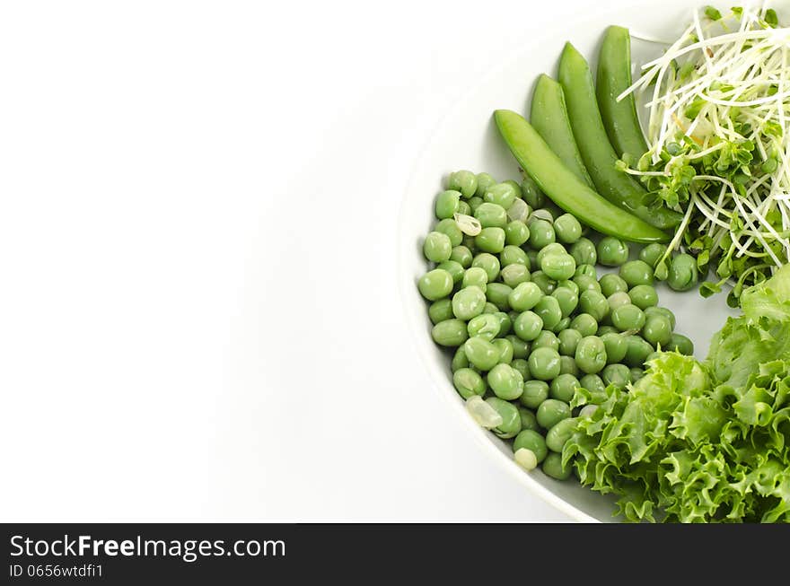 Green vegetable on white dish isolated on white background