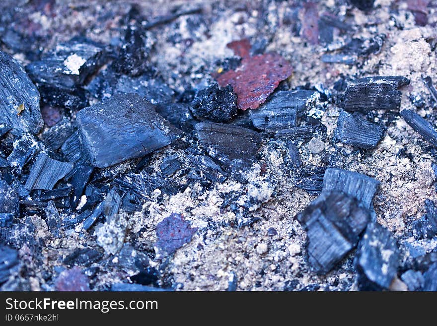 Cooled down black and grey coals from the fire. Cooled down black and grey coals from the fire