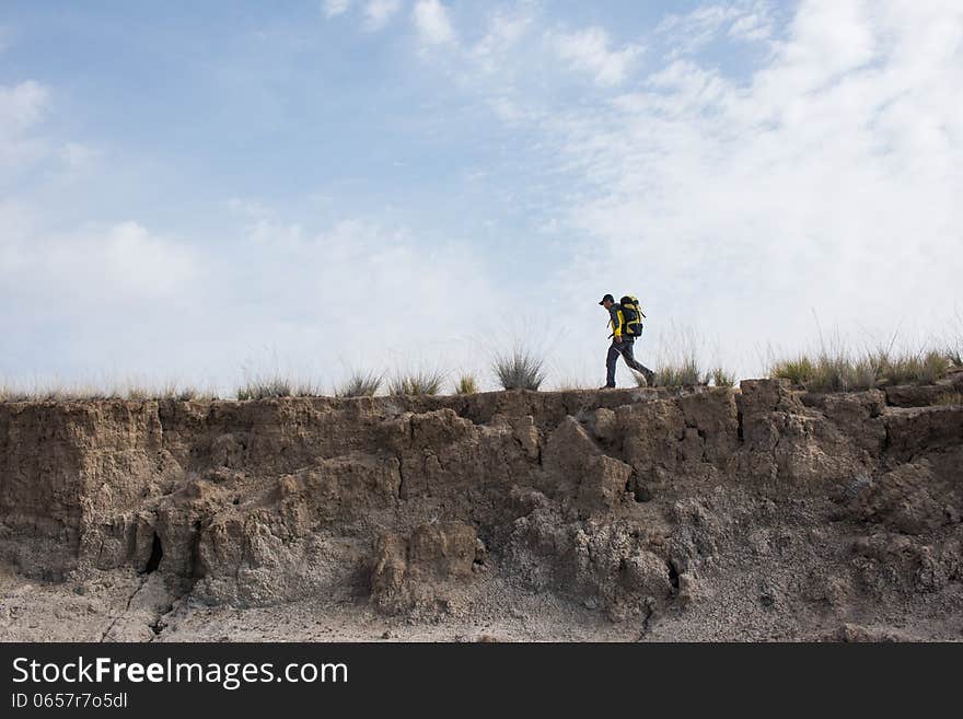 Hikers walking in autumn steep hill. Asian Youth. Hikers walking in autumn steep hill. Asian Youth