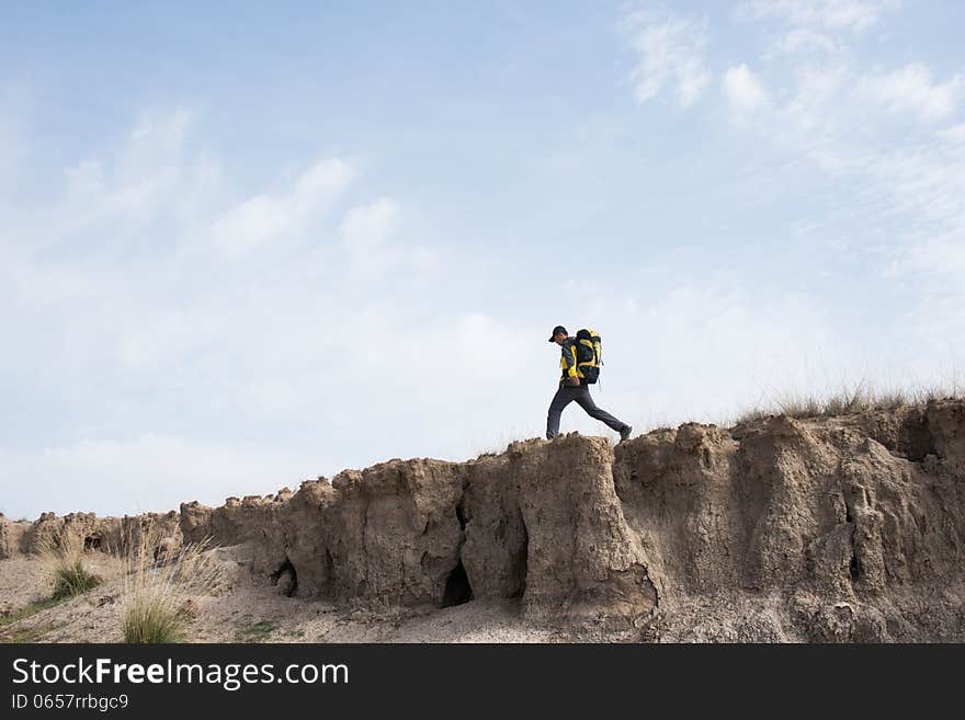 Hikers walking in a steep hill. Asian Youth. Hikers walking in a steep hill. Asian Youth