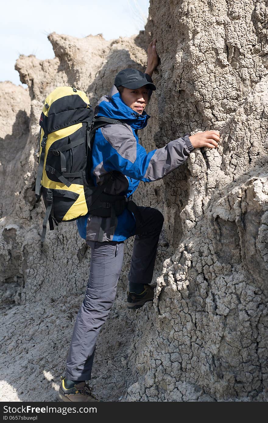 Hikers climbing steep slopes. Asian Youth Travelers. Hikers climbing steep slopes. Asian Youth Travelers