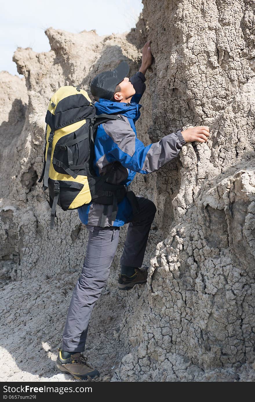 Hikers climbing steep slopes. Asian Youth Travelers. Hikers climbing steep slopes. Asian Youth Travelers