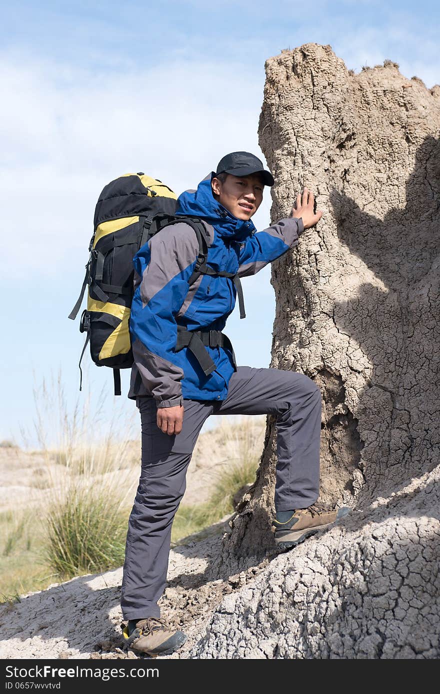 Hikers standing side resting on steep slopes. Hikers standing side resting on steep slopes