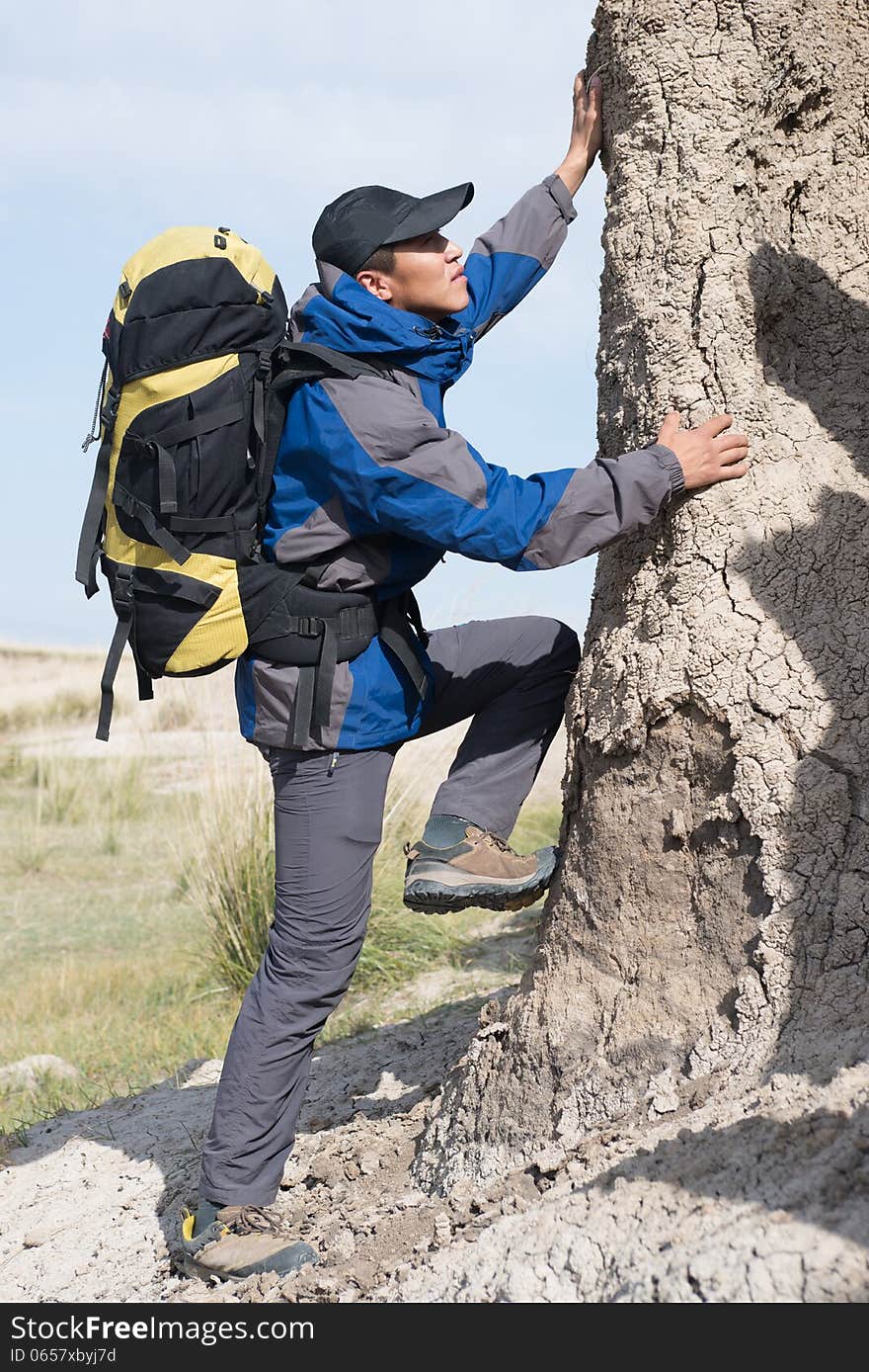 Hikers climbing steep slopes. Asian Youth Travelers. Hikers climbing steep slopes. Asian Youth Travelers