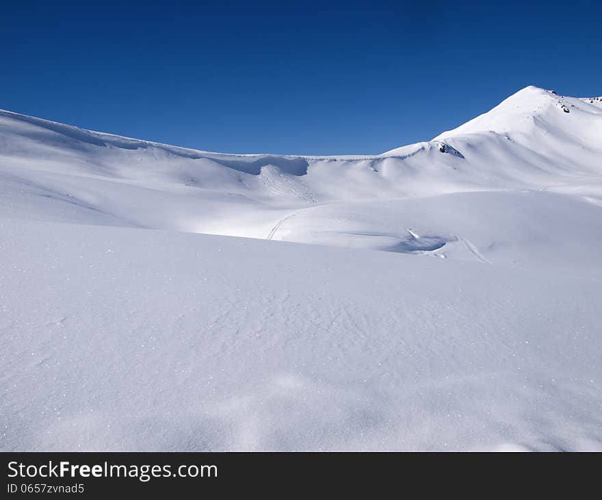 Winter landscape background high in the alps