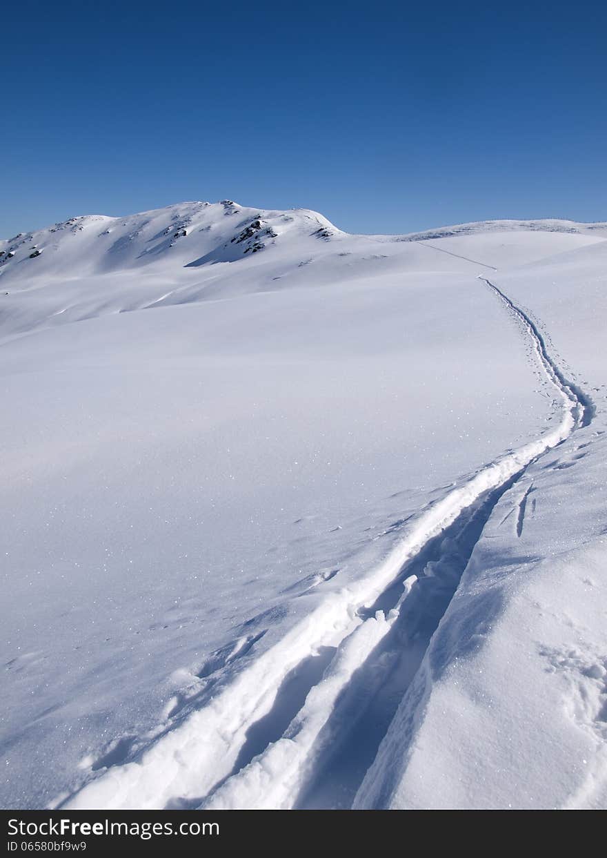 Deep skiing tracks in the snow on the alps at Koenigsleiten Austria. Deep skiing tracks in the snow on the alps at Koenigsleiten Austria