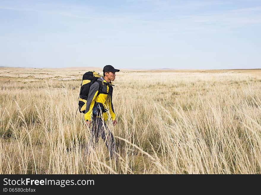 Hikers walking in autumn steep hill. Asian Youth. Hikers walking in autumn steep hill. Asian Youth