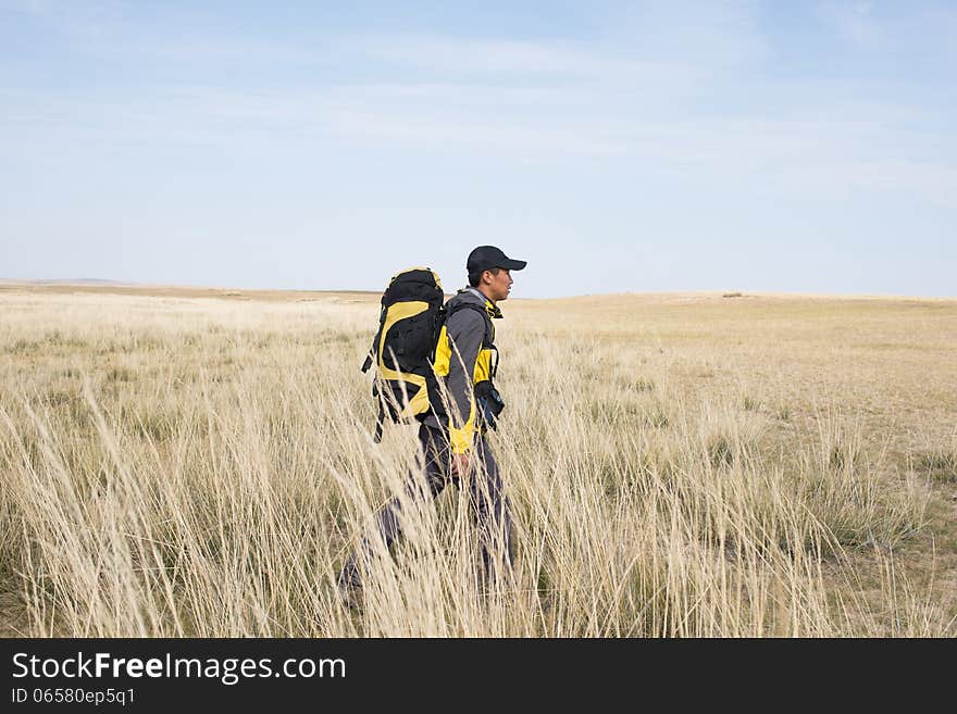 Hikers walking in autumn steep hill. Asian Youth. Hikers walking in autumn steep hill. Asian Youth