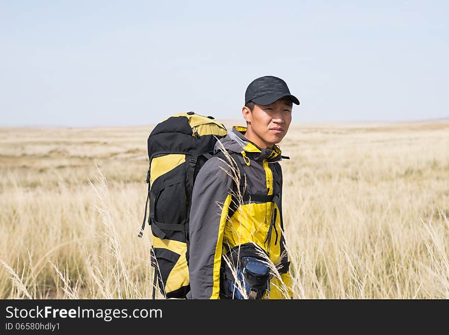 Hikers walking in autumn steep hill. Asian Youth. Hikers walking in autumn steep hill. Asian Youth