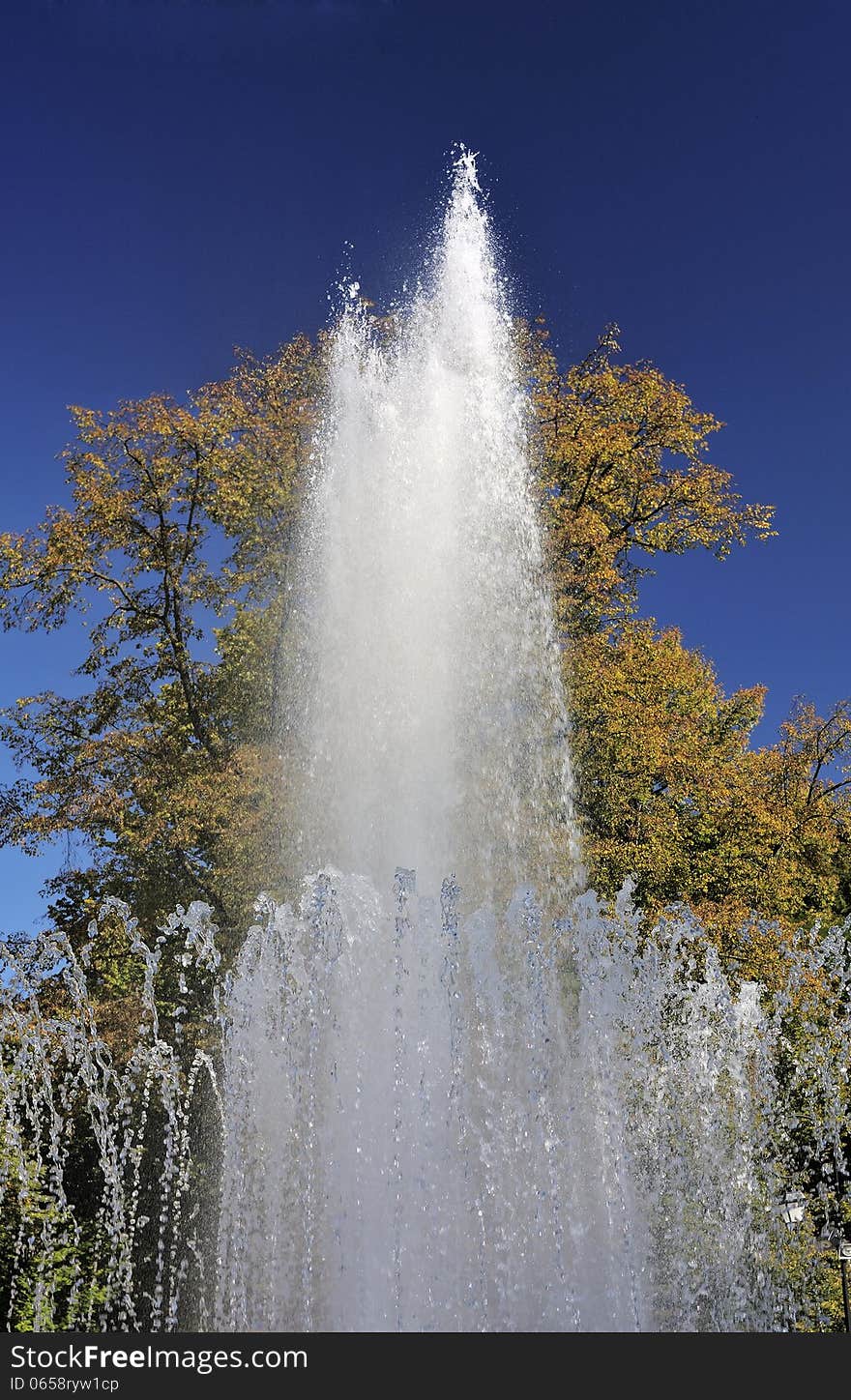 Splashes of fountain water in a sunny day