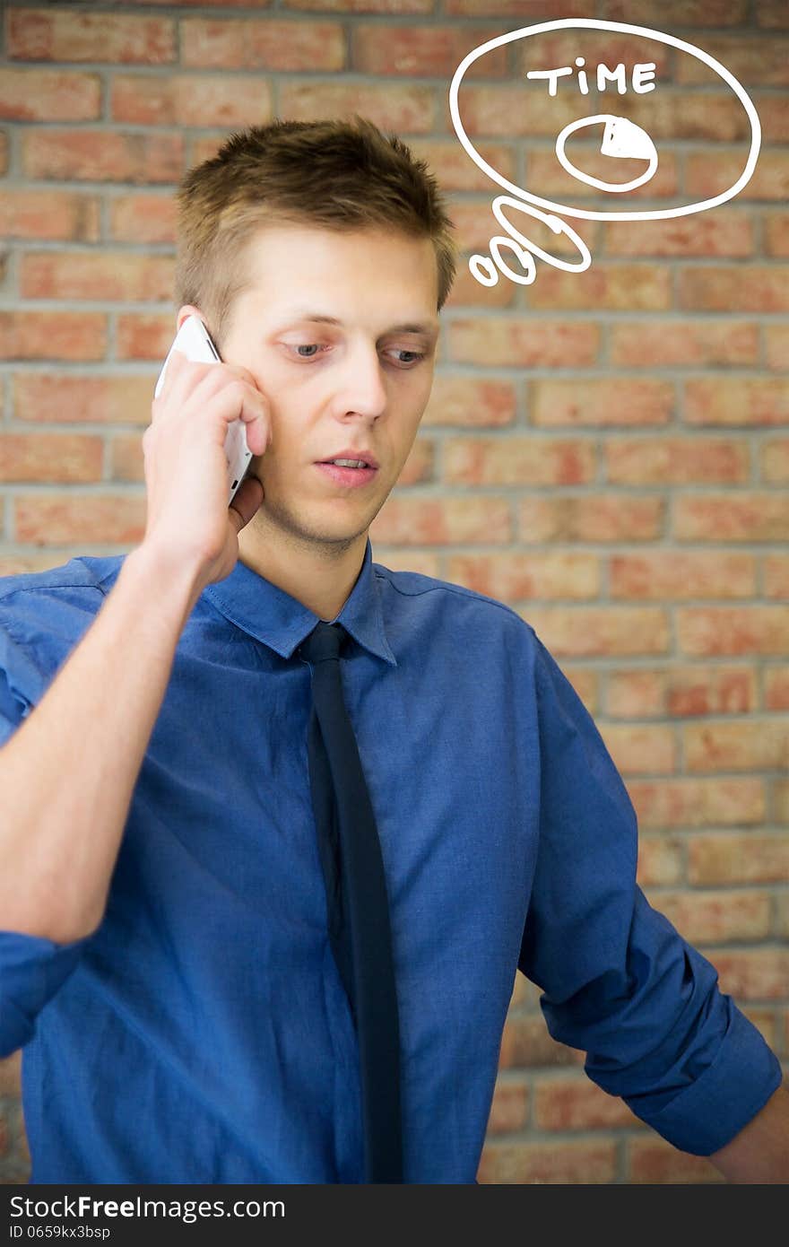 Young businessman talking on phone.