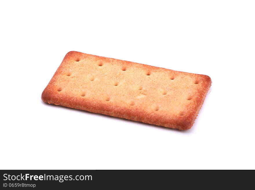 A piece of biscuit over white. A piece of biscuit over white.