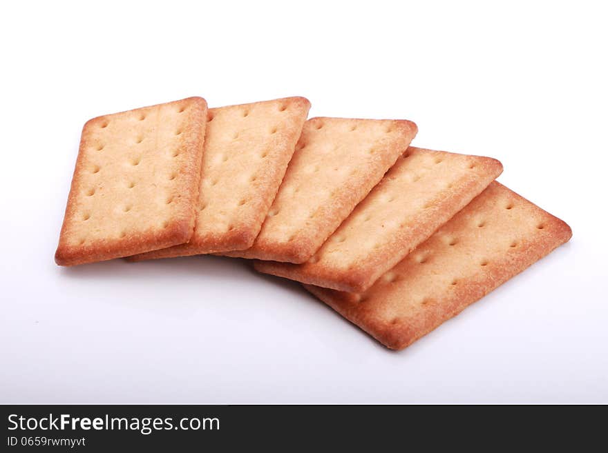 Stack of graham crackers over white.