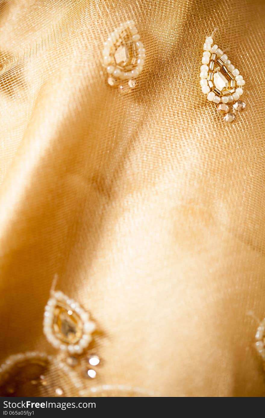 Texture of sari having net and beads, light yellow color. Texture of sari having net and beads, light yellow color