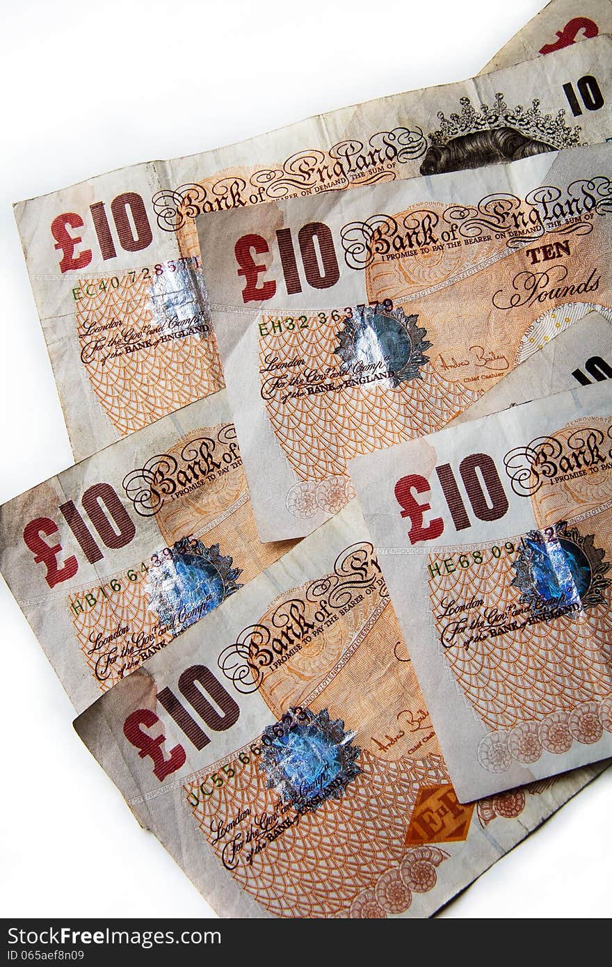 Group of used tenners pictured on a white background. Group of used tenners pictured on a white background