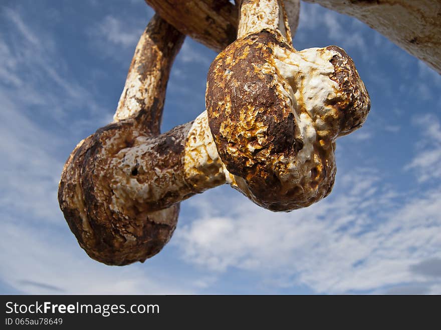 Rusty metal chunk with white painting