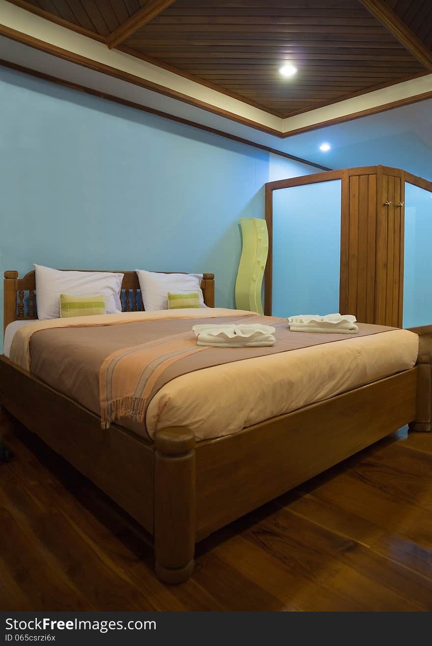 Nicely decorated bedroom in hotel, color coordinated