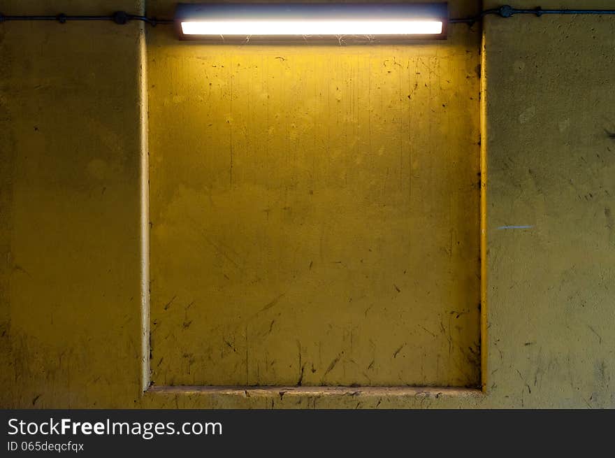 Yellow Dirty Wall Lit by Strip Light with Copy Space. Yellow Dirty Wall Lit by Strip Light with Copy Space
