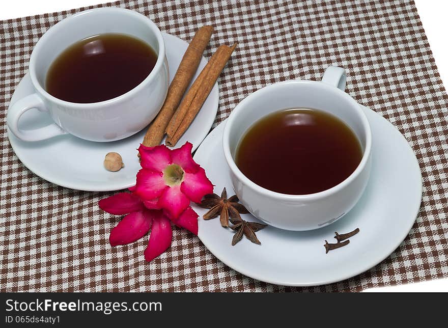 Two Teacups And Some Pink Flowers