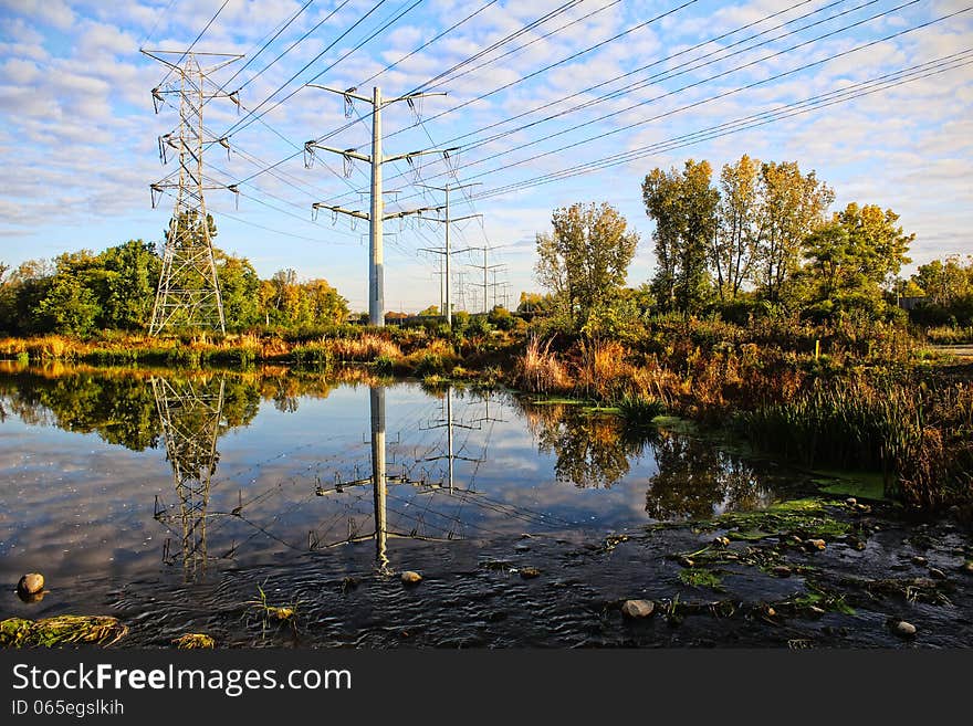 High-voltage towers sky background.