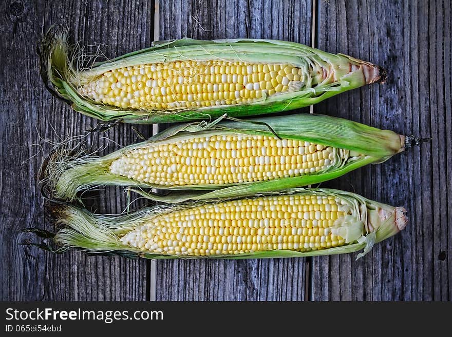 Corn cobs on a wooden table