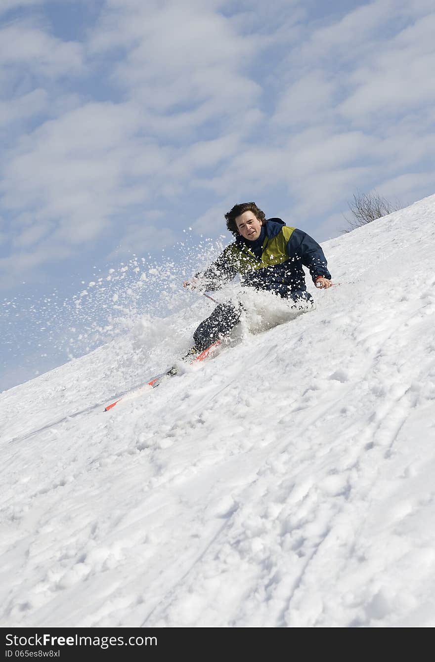 Skier falling on a steep snow slope. Skier falling on a steep snow slope