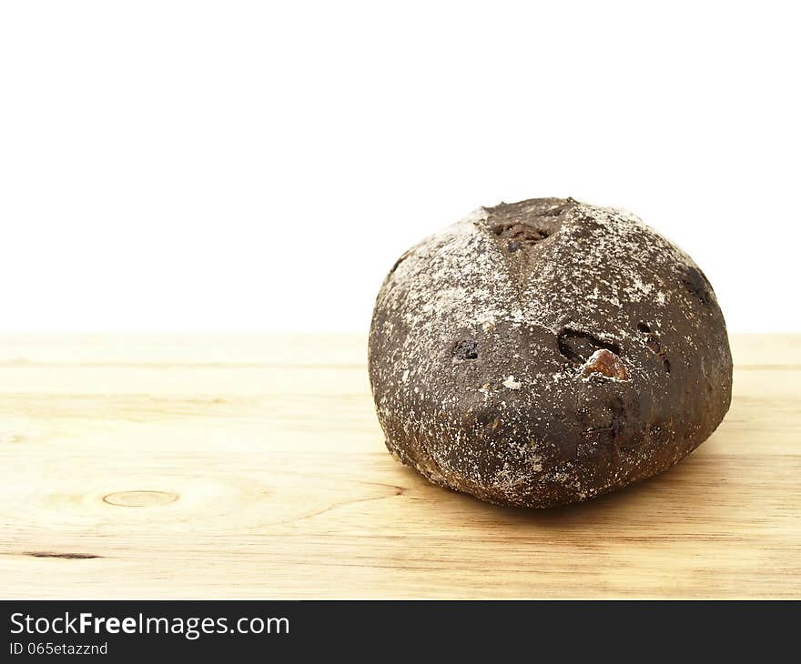 Banana loves choco soft bread on wood floor in white background. Banana loves choco soft bread on wood floor in white background