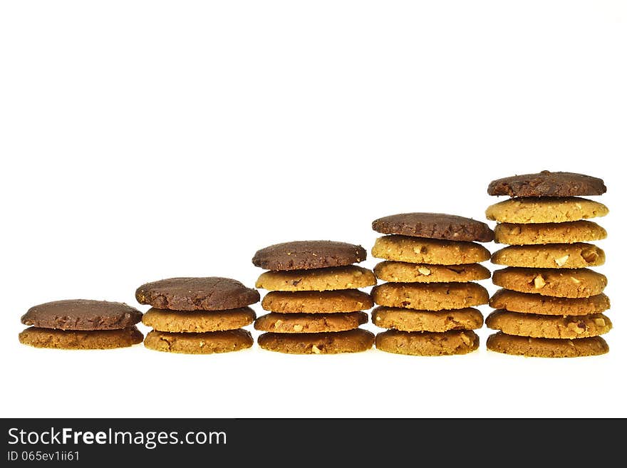 Step of increase stack almond cookie with brown cookie on top on white background. Step of increase stack almond cookie with brown cookie on top on white background