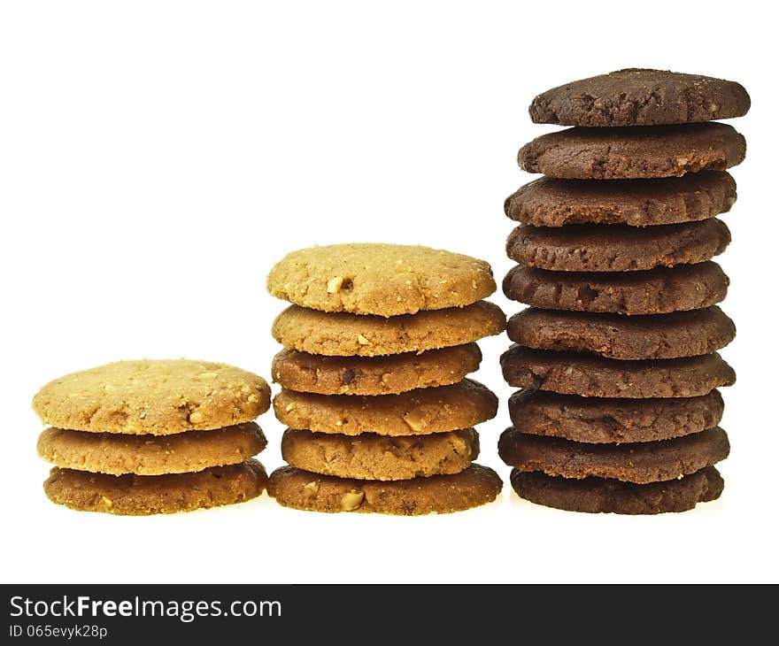 Three step stack increase of chocolate cookie and almond cookie on white background. Three step stack increase of chocolate cookie and almond cookie on white background