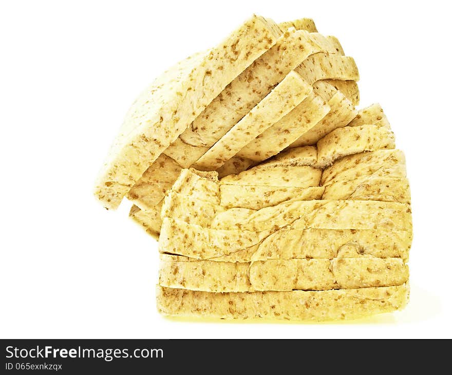 Side view of damage sliced bread on white background