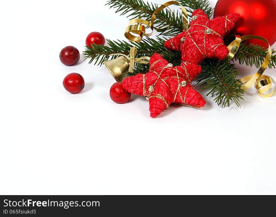 Christmas decoration with the twigs of the spruce and red stars