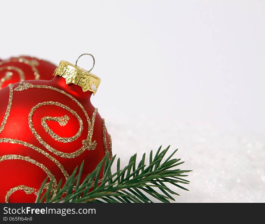 Red-golden baubles on the white background. Red-golden baubles on the white background