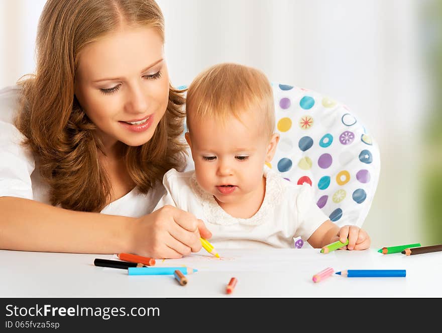 Mother and baby draw color pencil