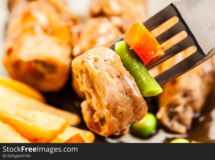 Close-up of beef rolls on fork