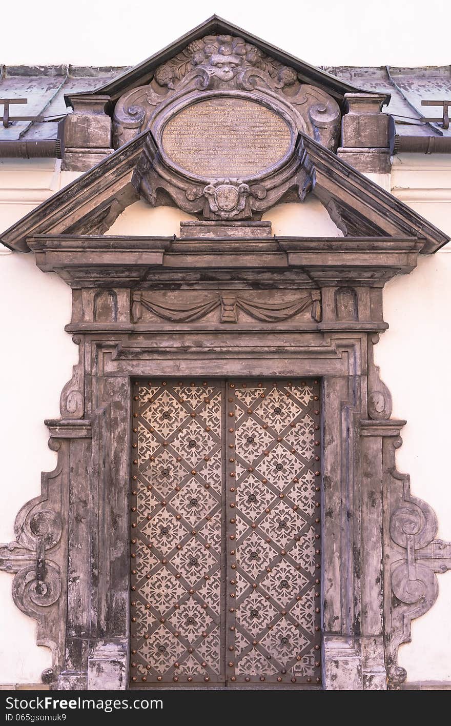 Old door , back entrance to the church St. Peter and Paul in Krakow . Poland