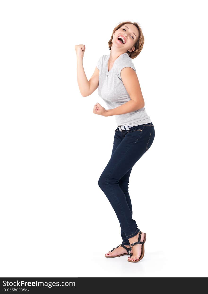 Beautiful happy woman celebrating success being a winner with dynamic energetic expression - isolated on white background. Beautiful happy woman celebrating success being a winner with dynamic energetic expression - isolated on white background