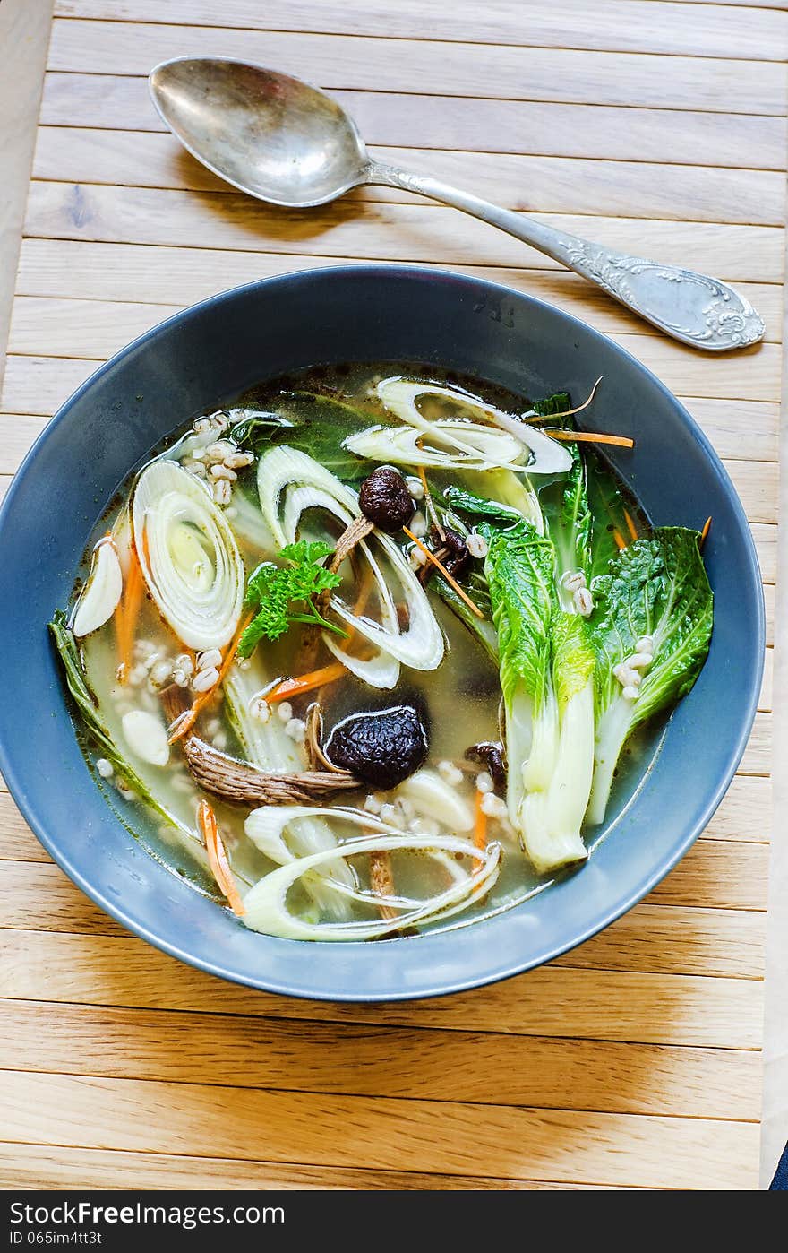 Asian broth with pak choy and barley