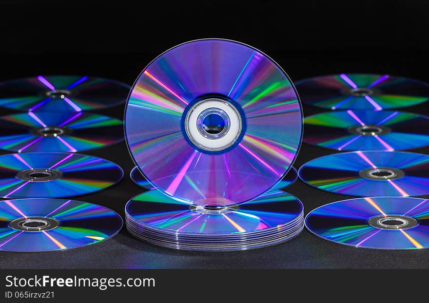 CD or DVD disc over black background