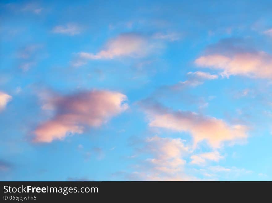 Beautiful cloudscape on bright sunset sky as background. Beautiful cloudscape on bright sunset sky as background