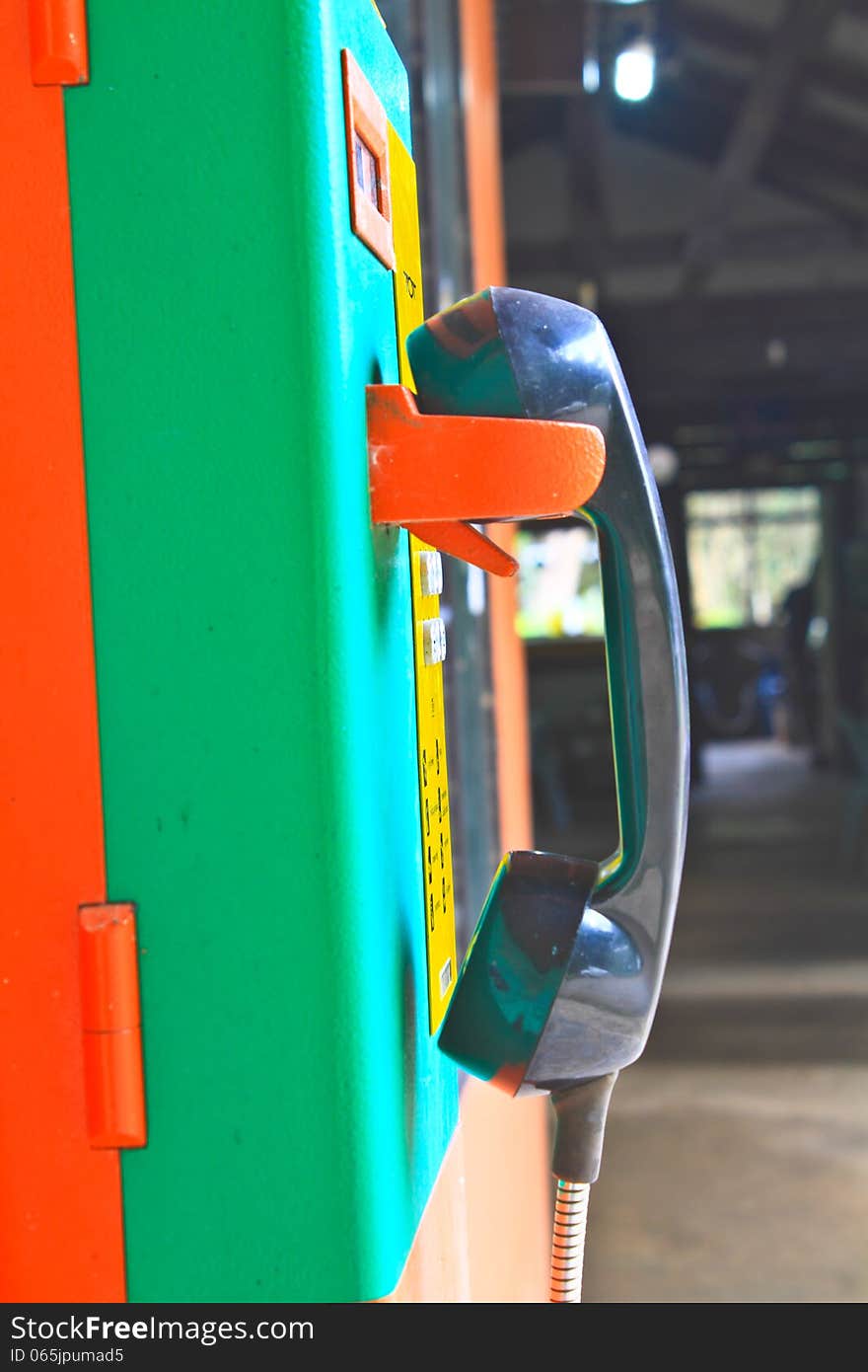 Close up public telephone coin in Thailand