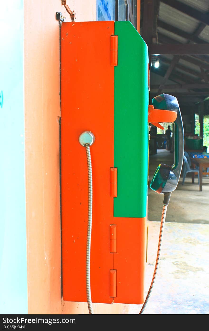 Close up public telephone coin in Thailand