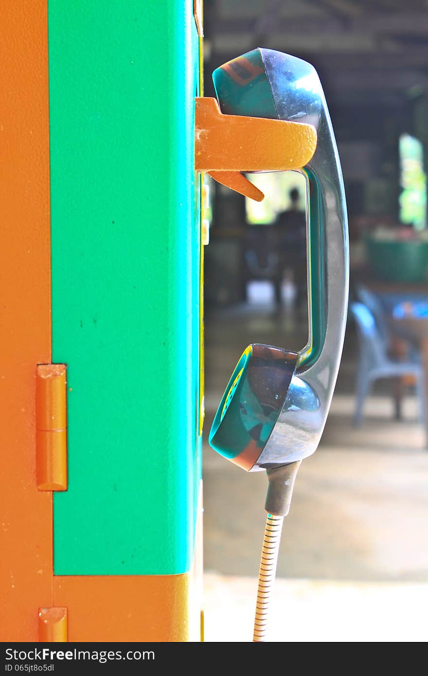 Close up public telephone coin in Thailand