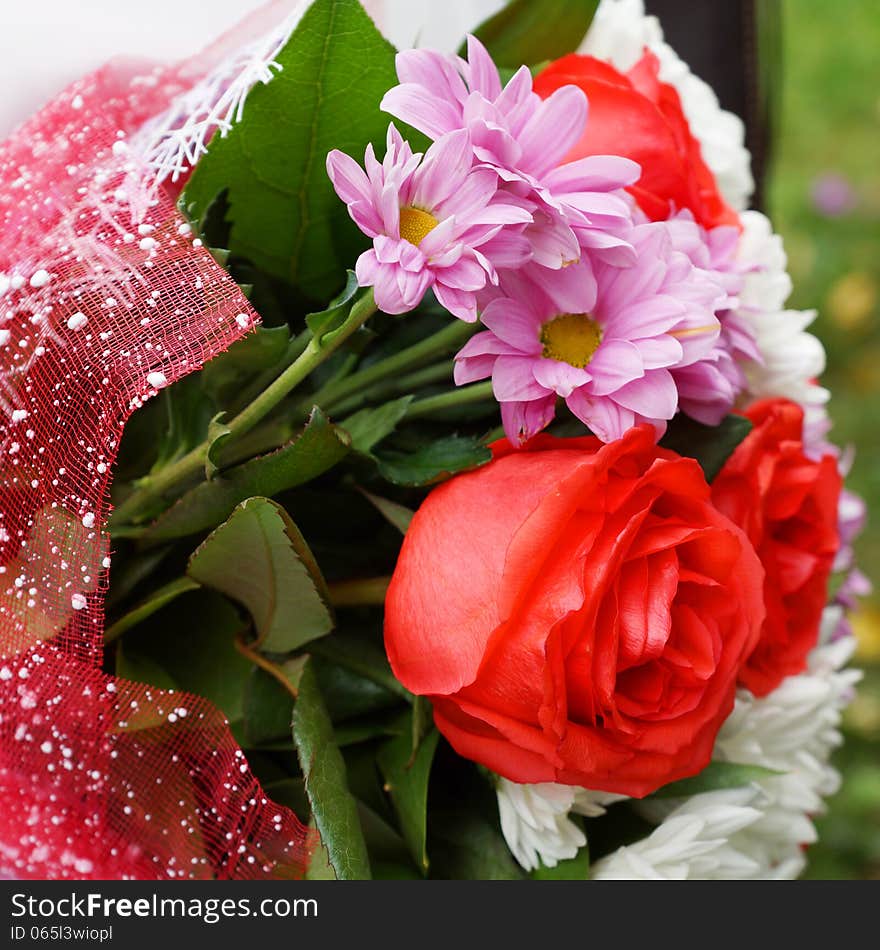 Bouquet Of Roses In A Festive Package