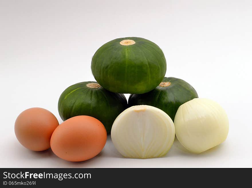 Ingredients for a healthy pancake, pumpkin, onion and eggs. Ingredients for a healthy pancake, pumpkin, onion and eggs