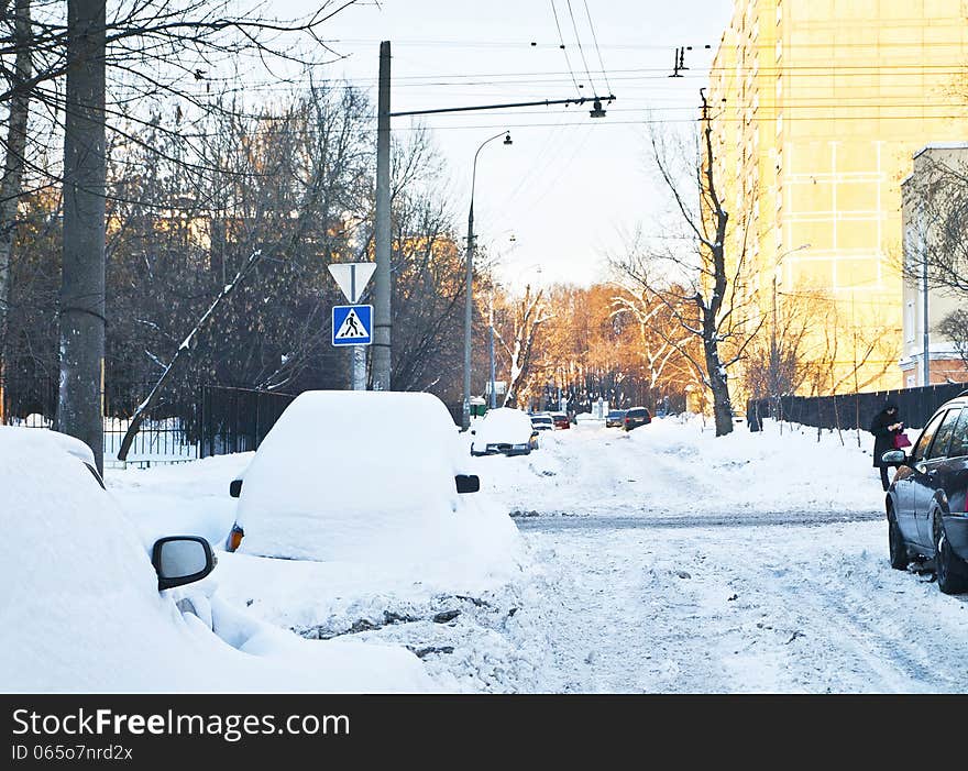 Snowy winter street, parked cars. Snowy winter street, parked cars